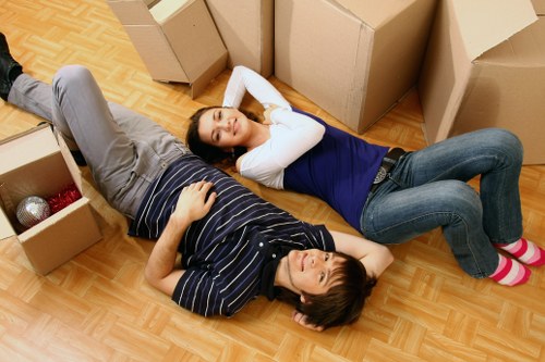 Professional removal truck driver loading cargo