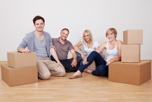 Professional movers organizing items for a safe transition